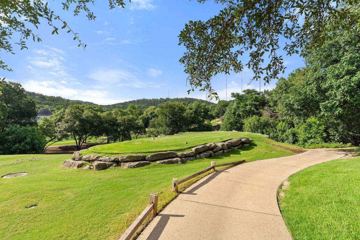 Travis Club golf course showing a paved path.